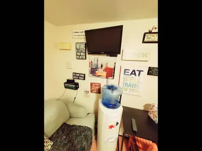 a room with a bed and a tv on a wall at Fall Room 3min From Yale, And Other Colleges in New Haven