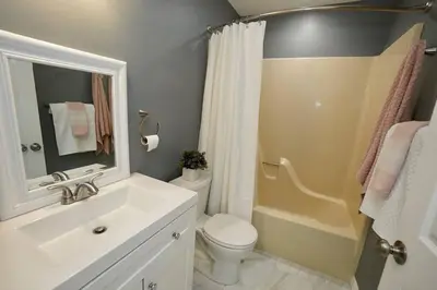 a bathroom with a sink and a toilet and a shower at A gorgeous home, 5BR-2BT, perfect for your family! in Tobyhanna