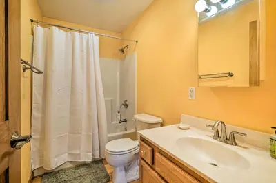 a bathroom with a white toilet and a sink at Wilmington Home on 18 Acres about 9 Mi to Skiing! in Wilmington