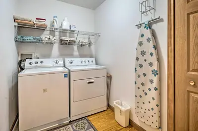 a small laundry room with a washer and dryer at Wilmington Home on 18 Acres about 9 Mi to Skiing! in Wilmington