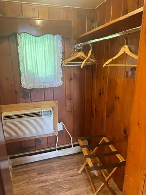 a tiny house with a fan and a window at Starlight Inn in Bennington