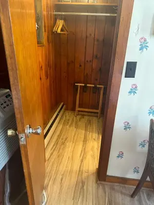 a door leading into a room with a wooden floor at Starlight Inn in Bennington