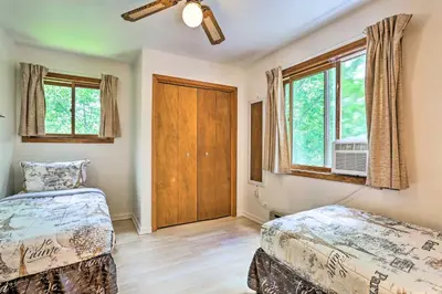 a bedroom with two beds and a window at Bushkill House with Deck and Community Amenities! in Bushkill