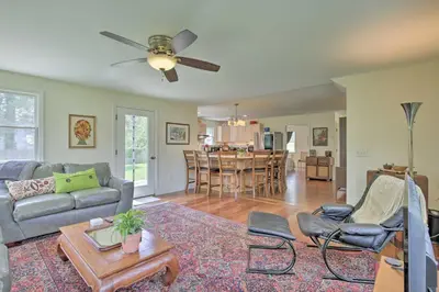 a living room with a couch and a table at Ashley Falls Home with Fire Pit Hike and Ski! in Ashley Falls