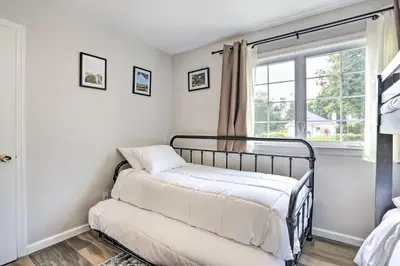a bedroom with a bed and a window at Ideally Located Glen Cove Apartment! in Glen Cove