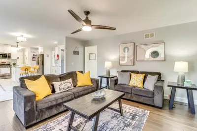 a living room with two couches and a table at Hot Tub! Family Tobyhanna Getaway 12 Mi to Slopes in Tobyhanna