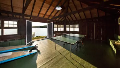 a ping pong table in a room with a pool table at Stunning Warren Lakefront Home Deck, Grill, Sauna in Warren