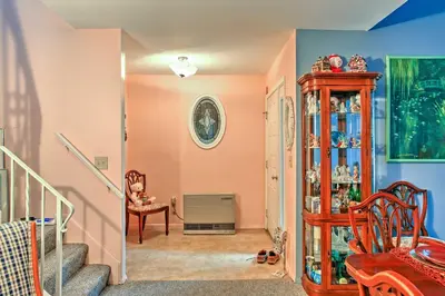 a living room with a staircase and a room with aventory at Malta House with Pool 9 Mi to Saratoga Race Course! in Ballston Spa