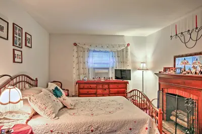 a bedroom with a bed and a dresser and a window at Malta House with Pool 9 Mi to Saratoga Race Course! in Ballston Spa