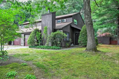 a house with a tree in the yard at Malta House with Pool 9 Mi to Saratoga Race Course! in Ballston Spa