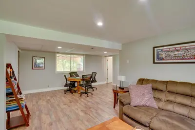 a living room with a couch and a table at Saratoga Springs Haven with Pool and Fire Pit! in Saratoga Springs