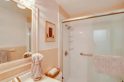 a bathroom with a shower with a glass door at Saratoga Springs Haven with Pool and Fire Pit! in Saratoga Springs