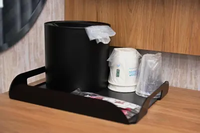 a black container sitting on top of a table at Days Inn by Wyndham Bronx NYC in Bronx