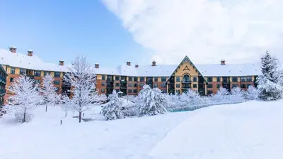 a building in the snow with snow covered trees at Mountain Creek Resort at Appalachian Hotel - Pool & Hot Tub in Vernon Township