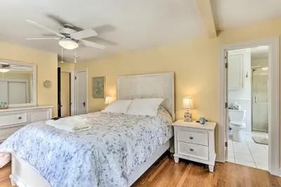 a bedroom with a bed and a bathroom at Walkable New Haven Retreat with Ocean Views! in New Haven