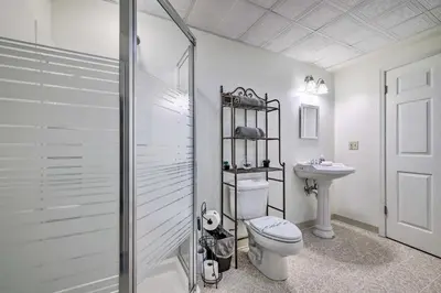a bathroom with a shower and a toilet and a sink at Tannersville Townhome, Near Camelback Mtn! in Tannersville
