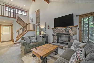 a living room with a fireplace and a tv at Tannersville Townhome, Near Camelback Mtn! in Tannersville