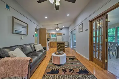 a living room with a couch and a table at 22 Mi to Ski Big Bear! Lake Wallenpaupack Getaway in Greentown