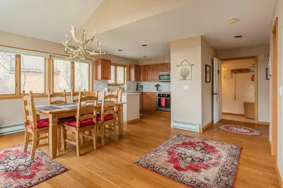 a kitchen and dining room with a table and chairs at Mountaintop Lookout with Hot Tub under the Stars in Hunter