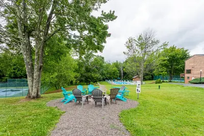 a group of chairs sitting around a table in a park at Redwood Retreat in Windham - minutes to Mtn! in Windham