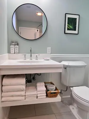 a bathroom with a sink and a mirror at Blue Vista Motor Lodge in Florida