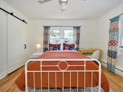 a bedroom with a bed and a window at Deck View of Hudson River & Mt Beacon / Boho Suite in Newburgh