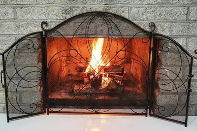 a fire inside of a metal cage with a fireplace at Serene 3-Bedroom Home with Dome, Hot Tub, Sauna in Hurleyville