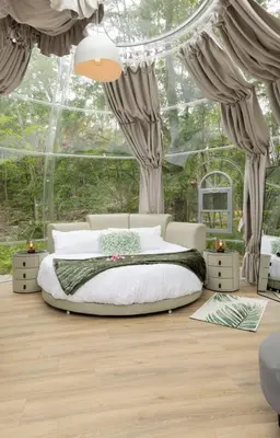 a bedroom with a bed in a room with windows at Serene 3-Bedroom Home with Dome, Hot Tub, Sauna in Hurleyville