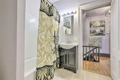 a bathroom with a sink and a mirror at Charming Springfield Apt Less Than 2 Mi to Downtown! in Springfield