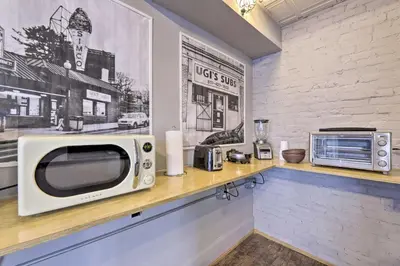 a microwave sitting on a counter in a kitchen at Charming Springfield Apt Less Than 2 Mi to Downtown! in Springfield