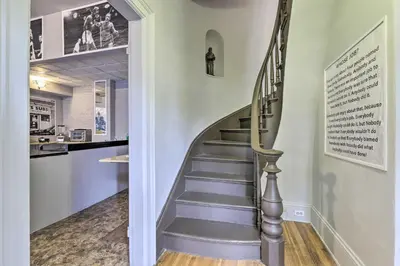 a staircase leading up to a kitchen with a stair case at Charming Springfield Apt Less Than 2 Mi to Downtown! in Springfield