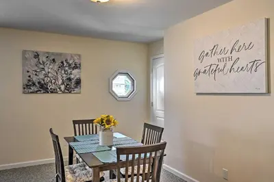 a dining room with a table and chairs at Glen Cove Home Walk to Boardwalk and Dining! in Glen Cove