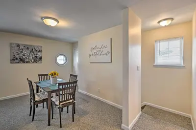 a dining room with a table and chairs at Glen Cove Home Walk to Boardwalk and Dining! in Glen Cove