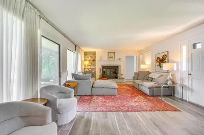 a living room with two couches and a fireplace at Water-View Home in the Berkshires in Sheffield