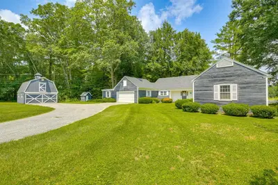 a house with a barn and a driveway at Water-View Home in the Berkshires in Sheffield