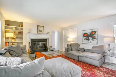 a living room with two couches and a fireplace at Water-View Home in the Berkshires in Sheffield