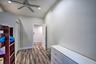 a bedroom with white walls and a ceiling fan at Pet-Friendly Saratoga Springs Home with Pool! in Saratoga Springs