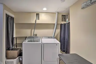 a laundry room with a washer and dryer in it at Pet-Friendly Saratoga Springs Home with Pool! in Saratoga Springs