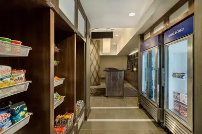 a hallway of a food pantry with a walk in refrigerator at Hilton Garden Inn New York Manhattan Midtown East in New York
