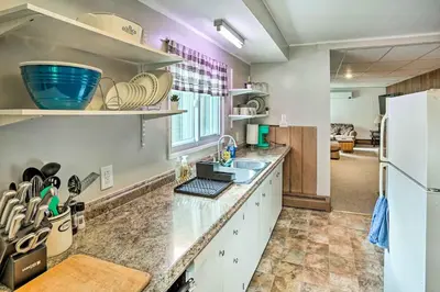 a kitchen with a sink and a refrigerator at Secluded Getaway Less Than 10 Mi to Saratoga Springs! in South Corinth
