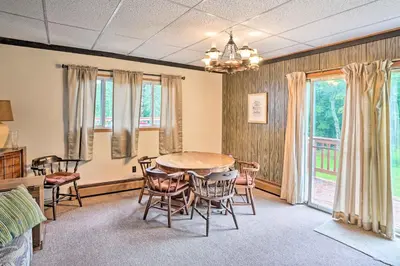a dining room with a table and chairs at Secluded Getaway Less Than 10 Mi to Saratoga Springs! in South Corinth