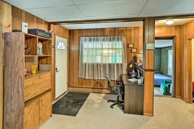 a home office with a desk and a bedroom at Secluded Getaway Less Than 10 Mi to Saratoga Springs! in South Corinth