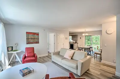 a living room with a couch and a table at Peaceful Athens Retreat at Sleepy Hollow Lake in Athens