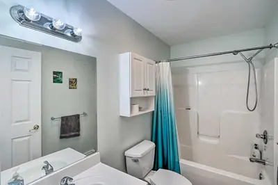a bathroom with a toilet and a shower and a sink at Peaceful Athens Retreat at Sleepy Hollow Lake in Athens