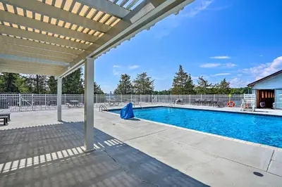 an outdoor swimming pool with a pergola and a swimming pool at Peaceful Athens Retreat at Sleepy Hollow Lake in Athens