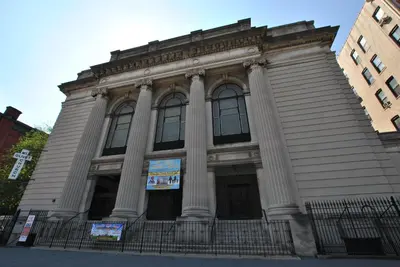 a building with columns on the front of it at Home NYC in New York