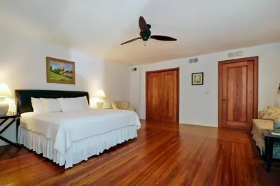 a bedroom with a bed and a ceiling fan at Home NYC in New York