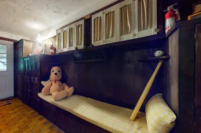 a teddy bear sitting on a shelf in a room at Hoot Owl Hollow in Jacksonville