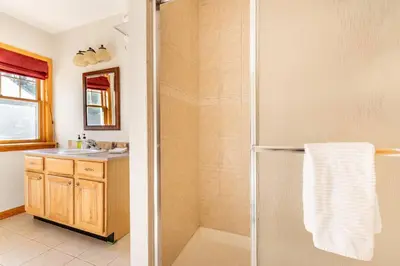 a bathroom with a shower and a sink at Beautiful mountain home with gorgeous meadow views in Hunter