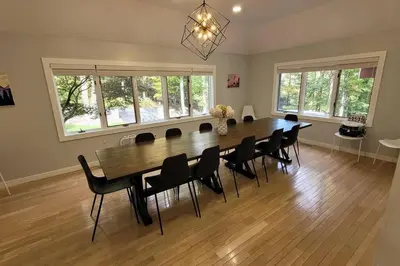 a dining room with a large table and chairs at Large Vacation Home Villa- Pool, Indoor Hotub, Game Room, up to 25 guests in Monticello